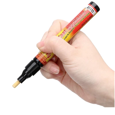 hand using CarScratcher Pencil